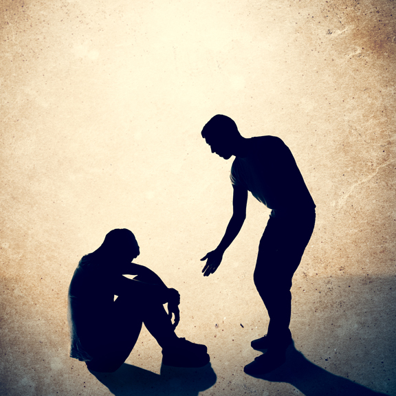 Graphical image - Silhouette of helping hand being offered from standing person to person on the ground